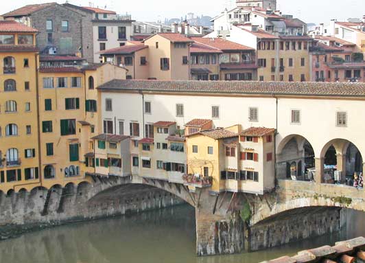 Authentic Florence: The iconic Ponte Vecchio (old bridge) dates from 1345. It's home to shops selling jewelry, art, and souvenirs. Photo credit: Art Moldavia.