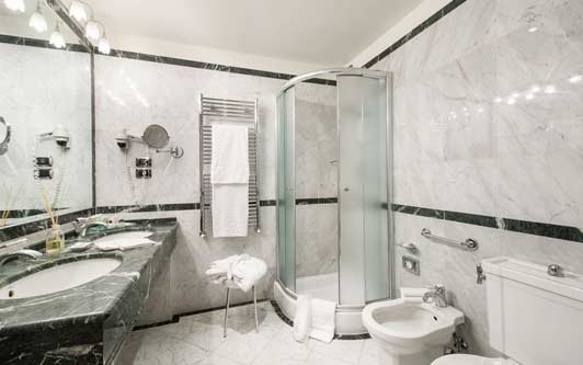 Grand hotels in Florence Italy often have large marble bathrooms - like this one at Hotel Degli Orafi.