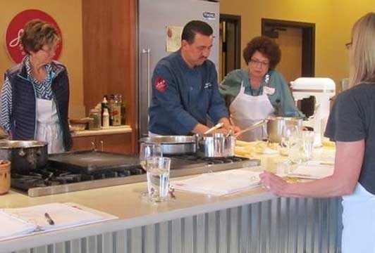Chef Noe Cano demonstrates tamale-making technique at the Santa Fe School of Cooking. Photo courtesy of the Santa Fe School of Cooking.