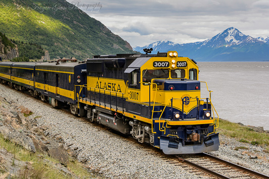 Alaska Railroad sightseeing trip making its way north along the Seward Highway. Passengers enjoy snow-capped mountain and glacier views, as well as wildlife such as Dall Sheep, moose, eagles, and the occasional bear. Credit: Victoria Lynn Pennick.