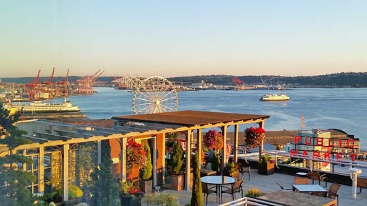 Seattle Great Wheel and ferries crisscrossing Puget Sound are best viewed from the roof deck at Inn at the Market.