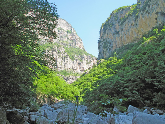 Here, Dino - walking Vikos Gorge - is dwarfed by the grand mountain scenery.